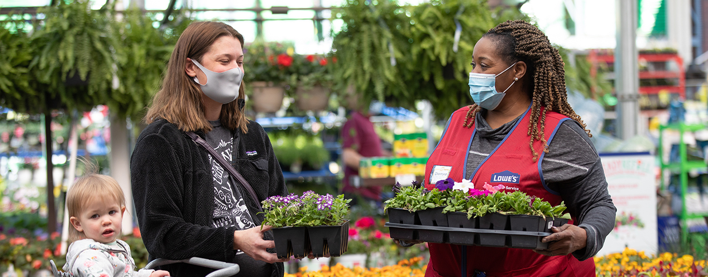 Lowe's associate with customer and child