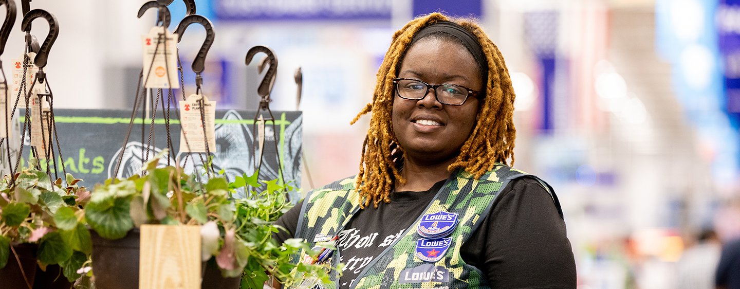 Female veteran associate smiling