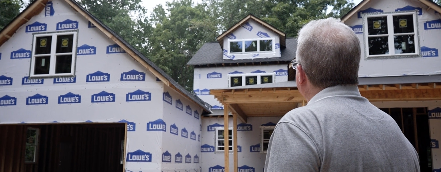 Man standing in front of home construction