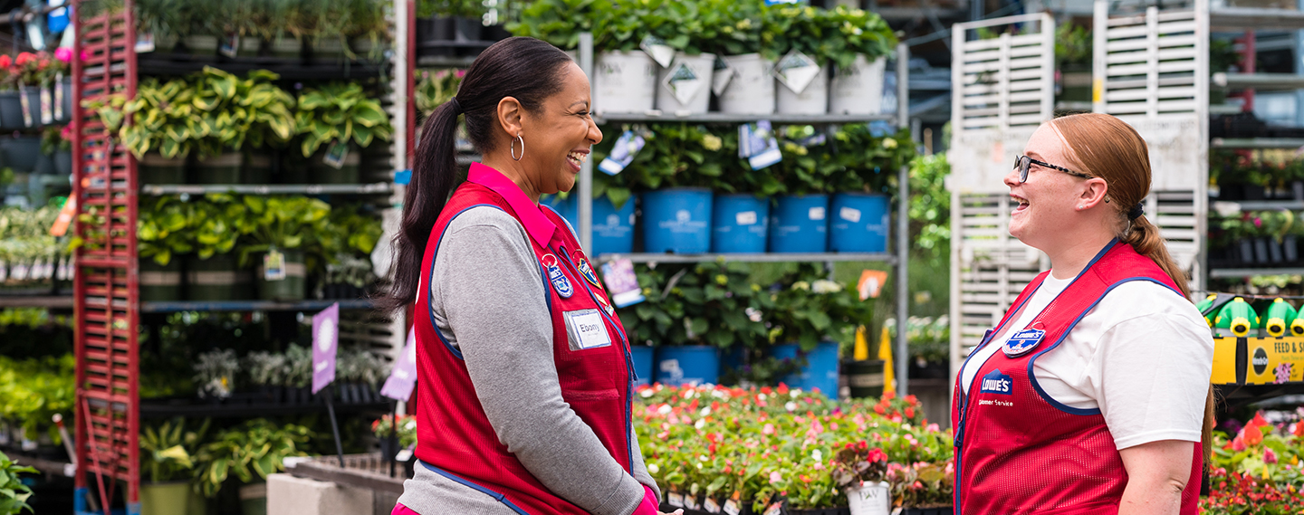 Two women Lowe's associates in garden center