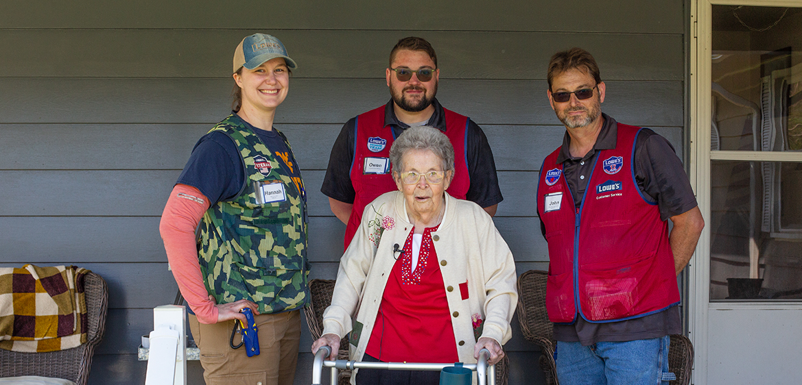 Sybil Gorby stands with Hannah Stallard, John Layton and Owen Yoke, associates from Lowe’s Store 1641 in Clarksburg, WV as the team refreshed Sybil’s garden in Tyler County, WV.