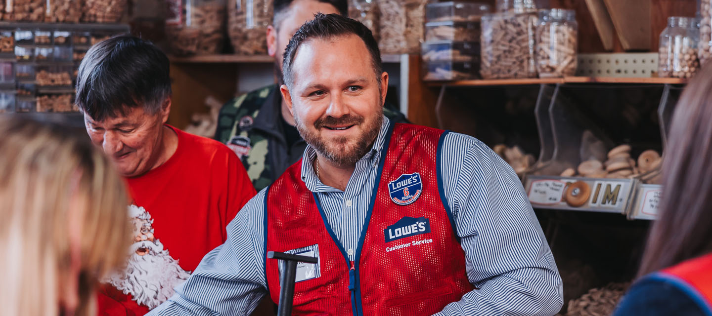 "Lowe's Store Manager Charlie Bryant volunteers at The Toy Shoppe""