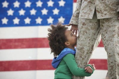 Girl hugging his leg
